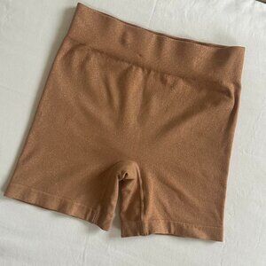 SKIMS gold glitter shimmery seamless bike short thick waistband